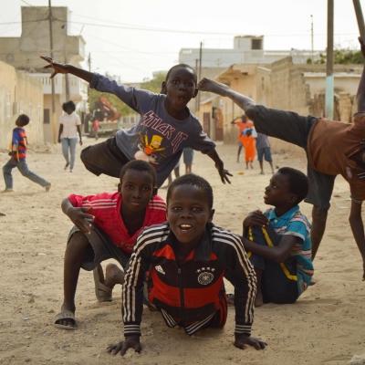 Talibe children play in the streets of dusty St. Louis in Senegal. Talibe children play in the streets of dusty St. Louis in Senegal.